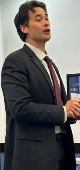 Kenneth Applegate speaking at an event