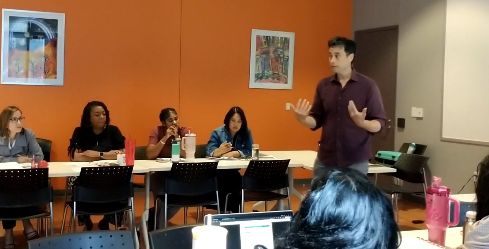 Kenneth Applegate leading a workshop with educators seated at tables