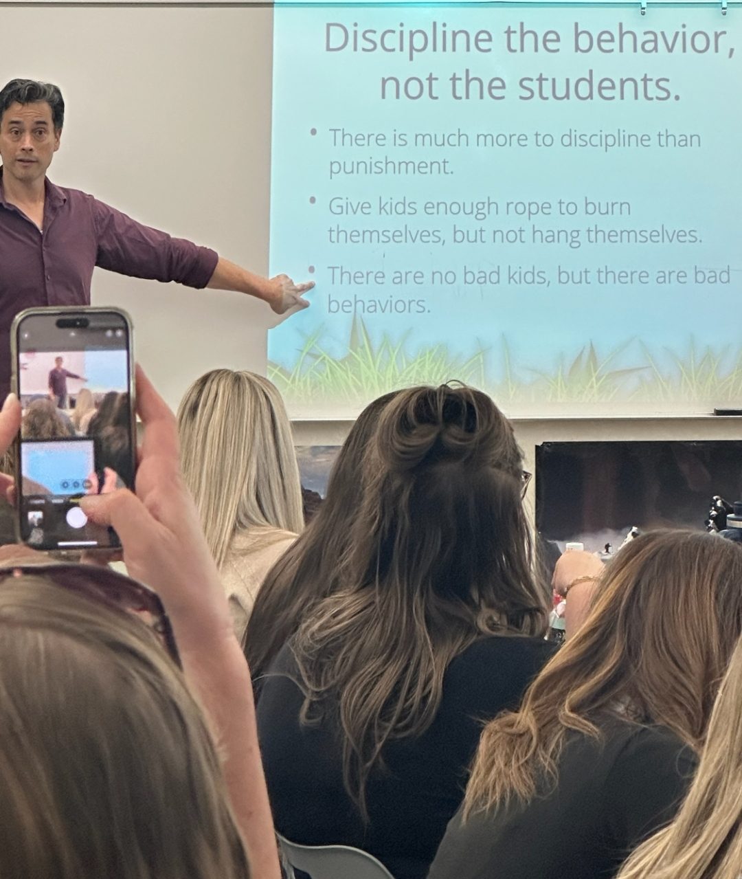 Kenneth Applegate pointing to a slide that reads Discipline the behavior, not the students